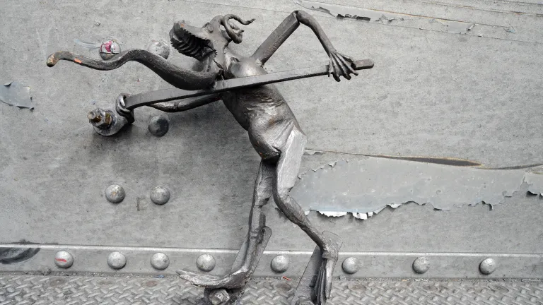 Measuring 2 feet tall and wielding a spud wrench, the senior troll sports spiraling goat horns, a gaping muzzle, a dragon tongue-beard and webbed feet that are suggestive of a great mythological creature. 