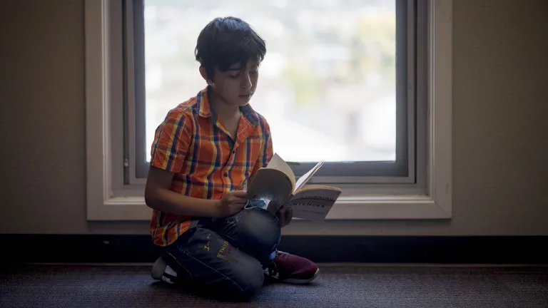 A boy reading a book.