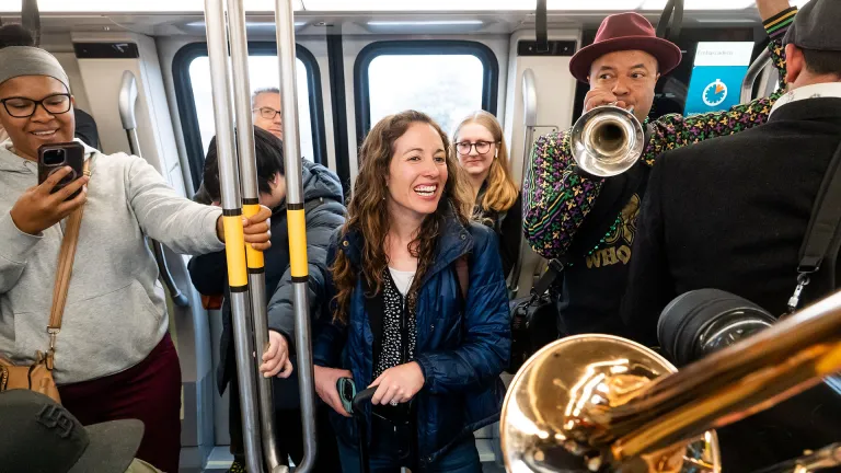 Commuters enjoying an impromptu brass band concert on a BART train.