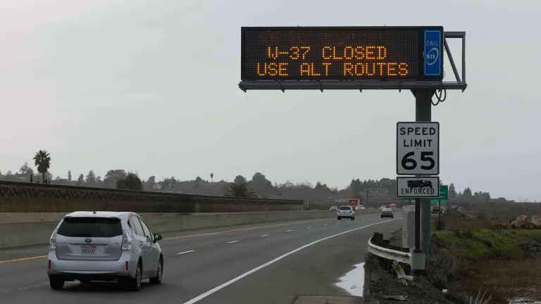 A highway message sign indicating closures of Highway 37.