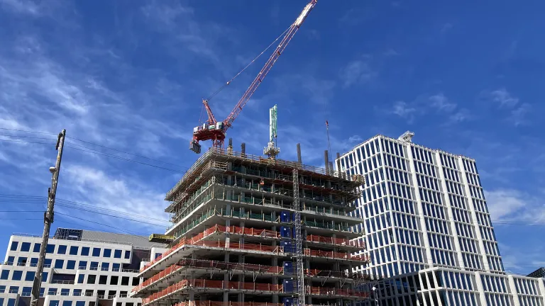 Housing construction site against a beautiful blue sky.