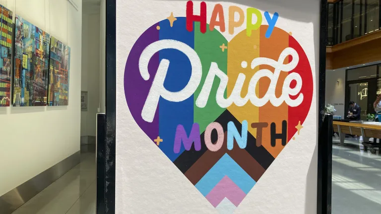 Sign reading Happy Pride Month at the Bay Area Metro Center.
