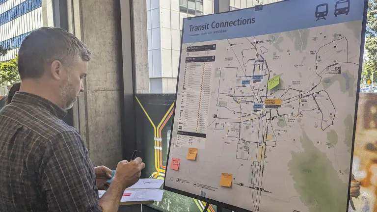 A person reviews a mockup of a new Transit Connections map.