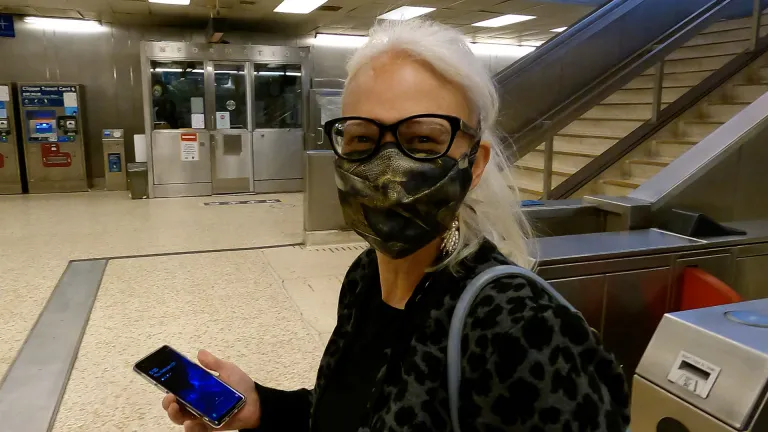 MTC/ABAG Executive Director Therese McMillan using the Clipper mobile app at a BART station.