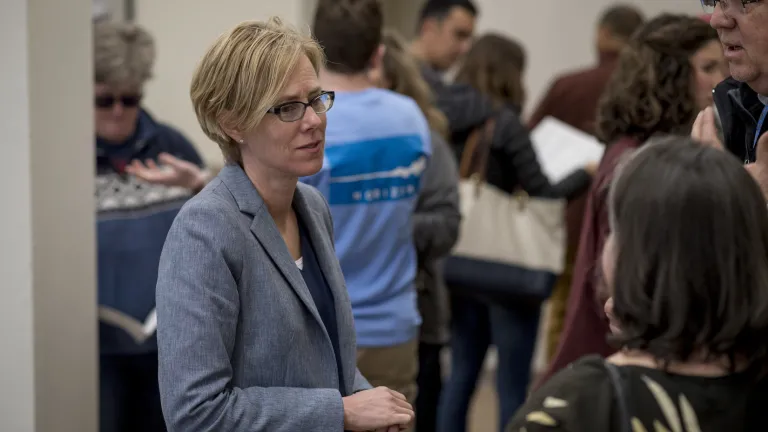 MTC Deputy Executive Director Alix Bockelman speaks with residents at a Plan Bay Area 2050 public meeting in Vallejo.