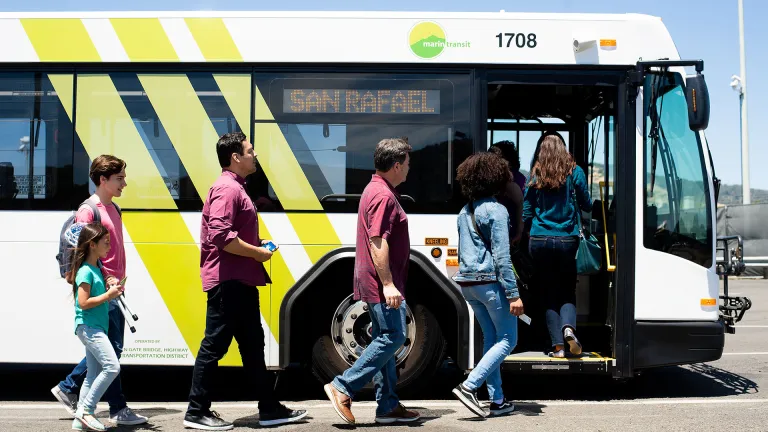 Passengers boarding a Marin Transit bus.