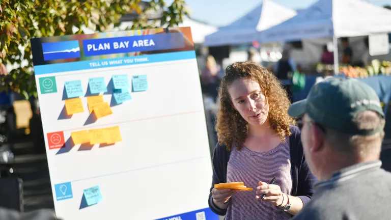 MTC/ABAG staff talking with members of the public at a Plan Bay Area pop-up event.