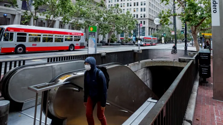 Embarcadero BART Station with a MUNI bus on Market Street in San Francisco