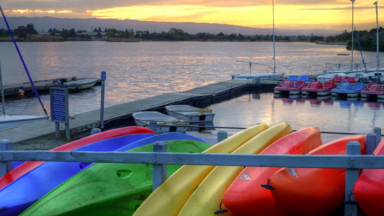 Kayaks docked alongside San Francisco Bay