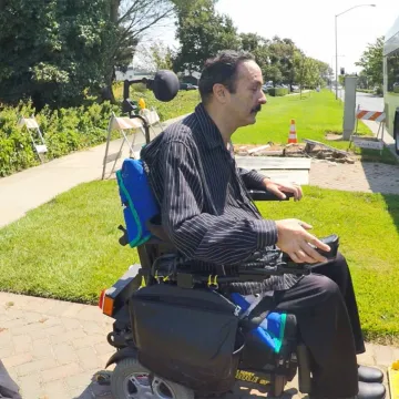 Wheelchair user boarding Solano Transportation Authority bus