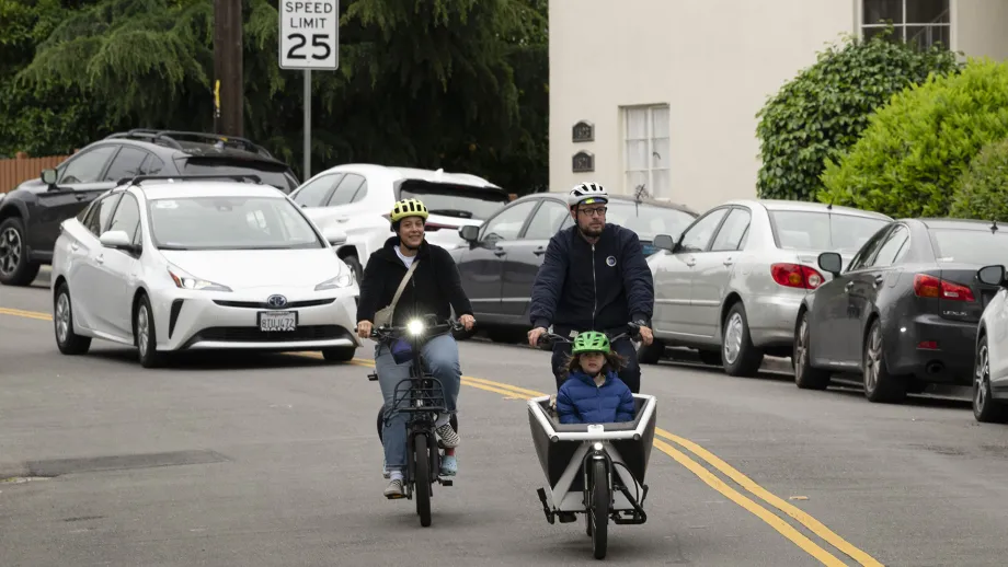 A family biking on Bike to Wherever Day in Oakland.