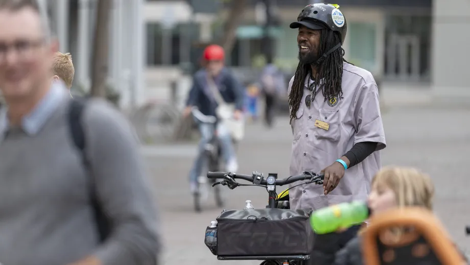 A smiling cyclist on Bike to Work Day in Oakland.