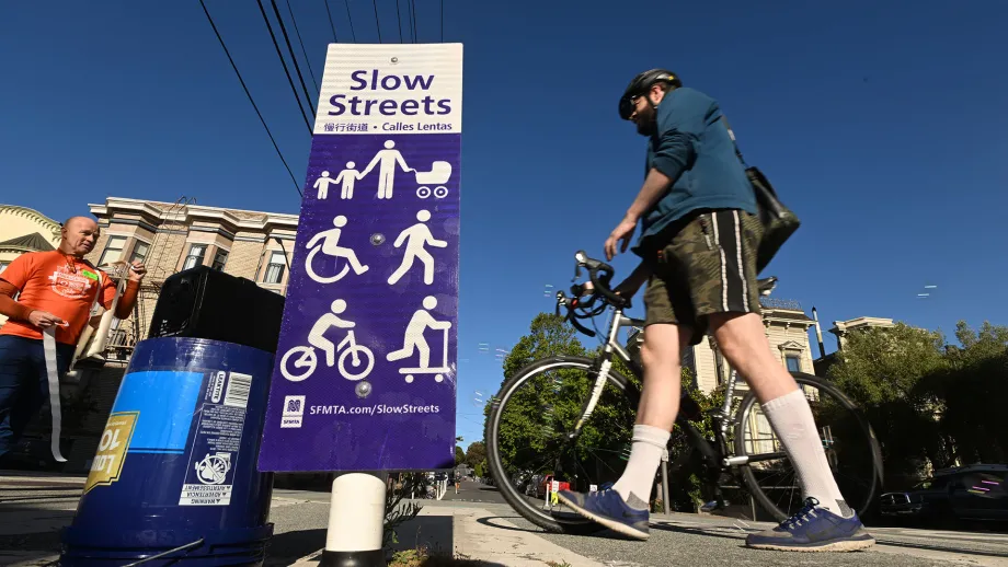 A cyclist walks to an energizer station on Bike to Work Day.