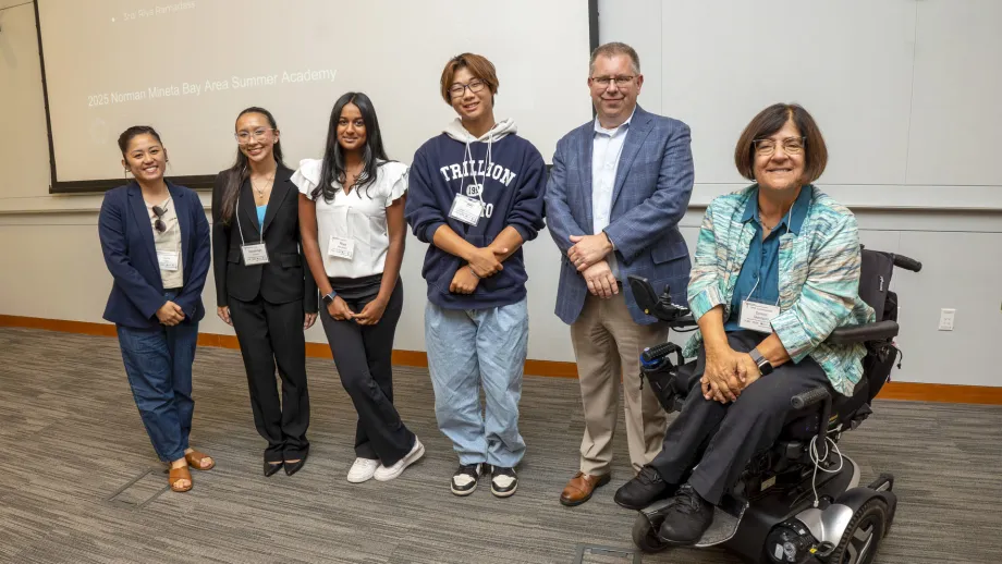 Commissioner Dorene Giacopini, Policy Advisory Council chair Carina V. Lieu and MTC chief operating officer Nick Roethel with capstone presentation winners from the 2025 class of the Norman Mineta Summer Academy.