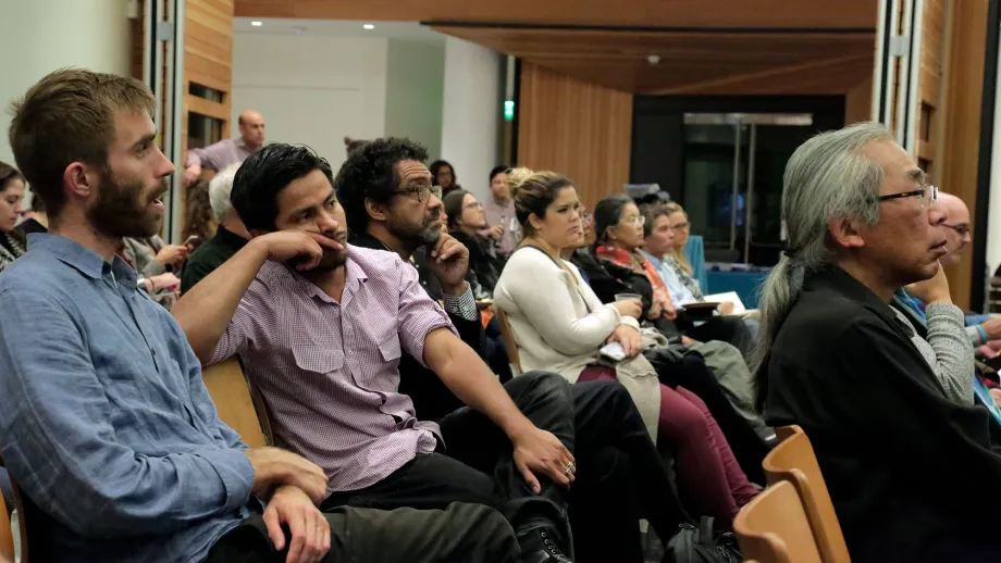 audience listening to speakers