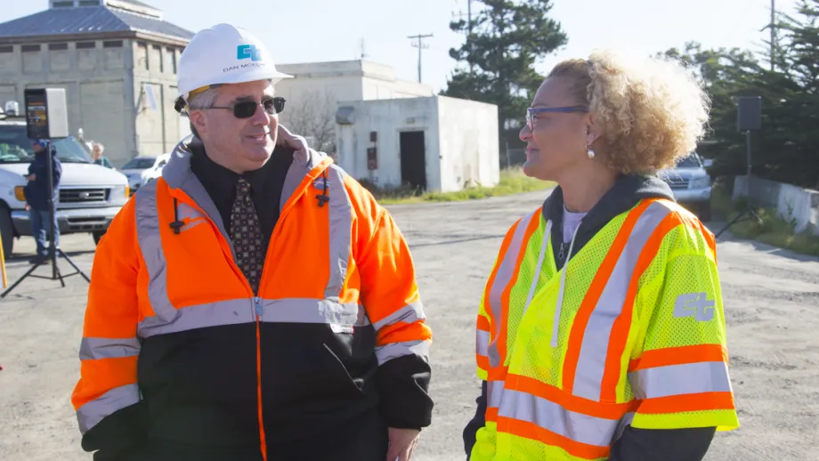 two construction workers talking