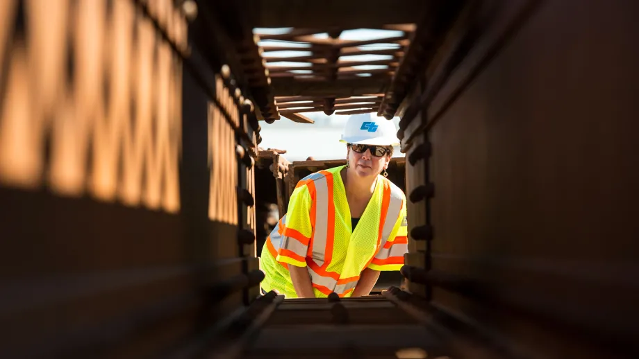 construction worker looking at steel beam