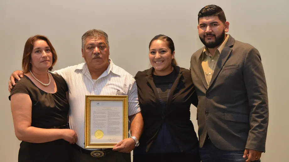 Freeway Service Patrol tow truck driver Moises Reyes with his wife and family