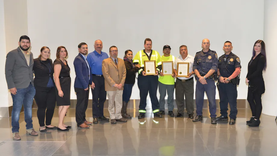 Darryl Poe and Moises Reyes with family, CHP officers and MTC FSP program staff