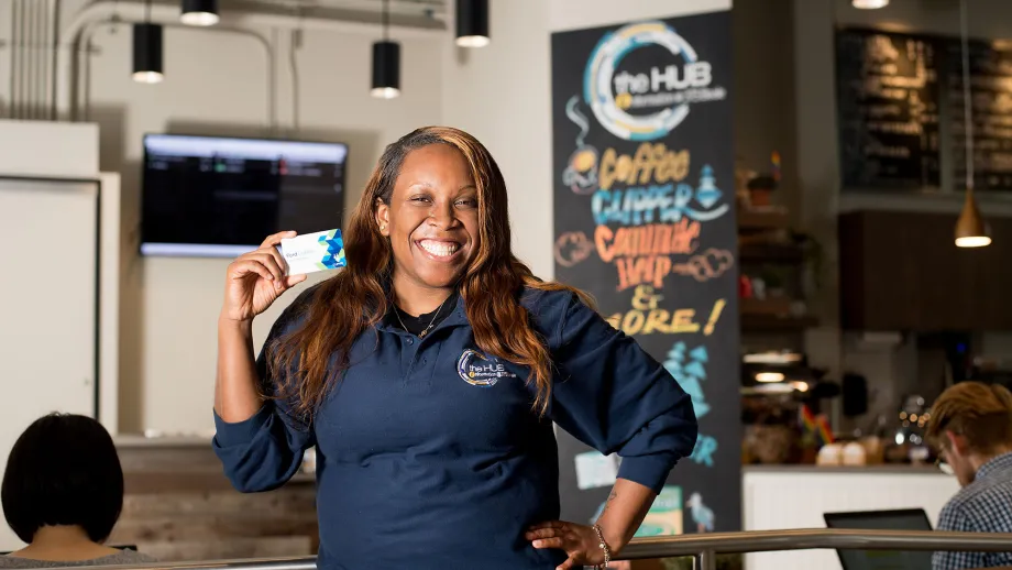 Woman holding a clipper card