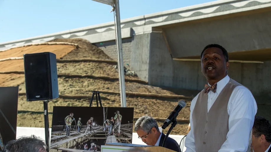 Man at podium talking to a crowd
