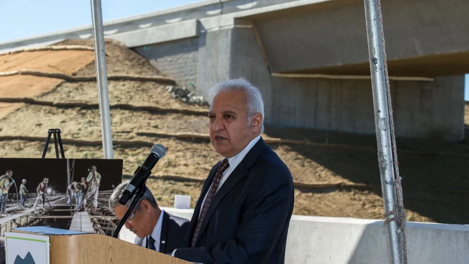 Man at podium talking to a crowd