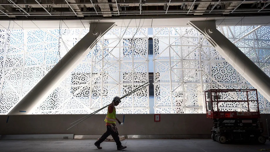 man walking through Transbay Transit Center