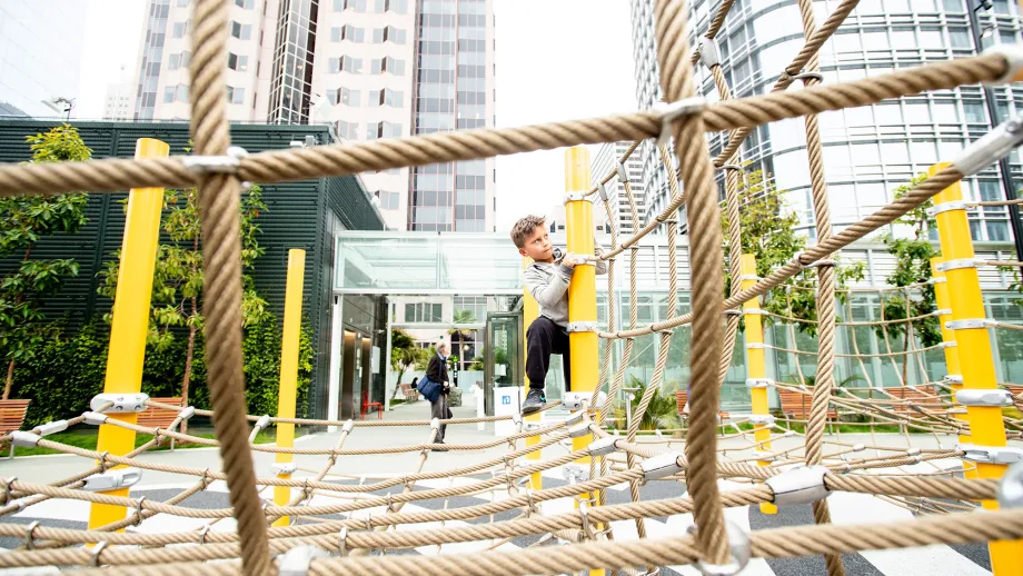 Leo Bates, 7, plays at the Salesforce Transit Center during the opening day of AC Transit Service