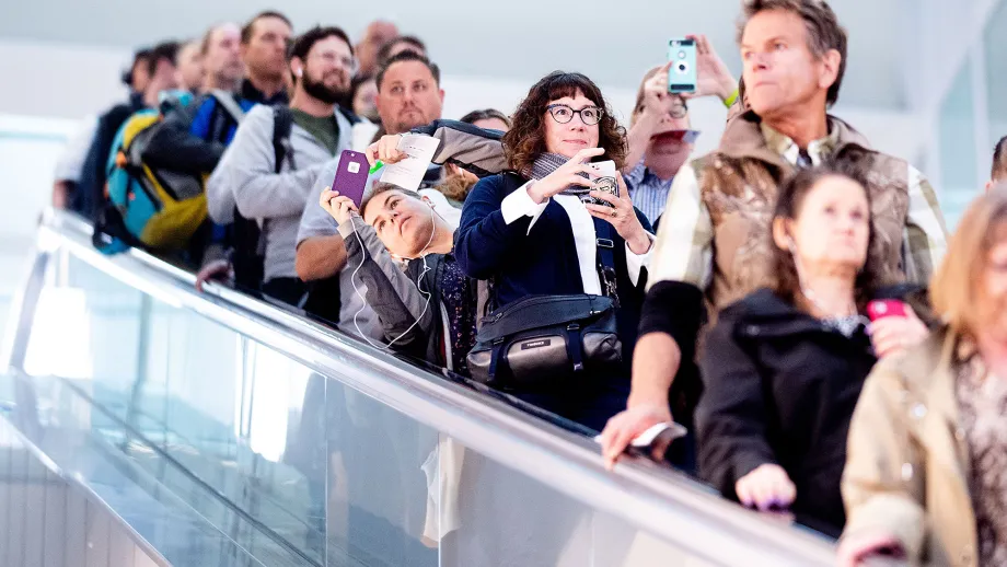 Commuters photograph the Oculus as they disembark at the Salesforce Transit Center during the first day of AC Transit service