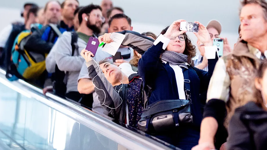 Commuters photograph the Oculus as they disembark at the Salesforce Transit Center during the first day of AC Transit service