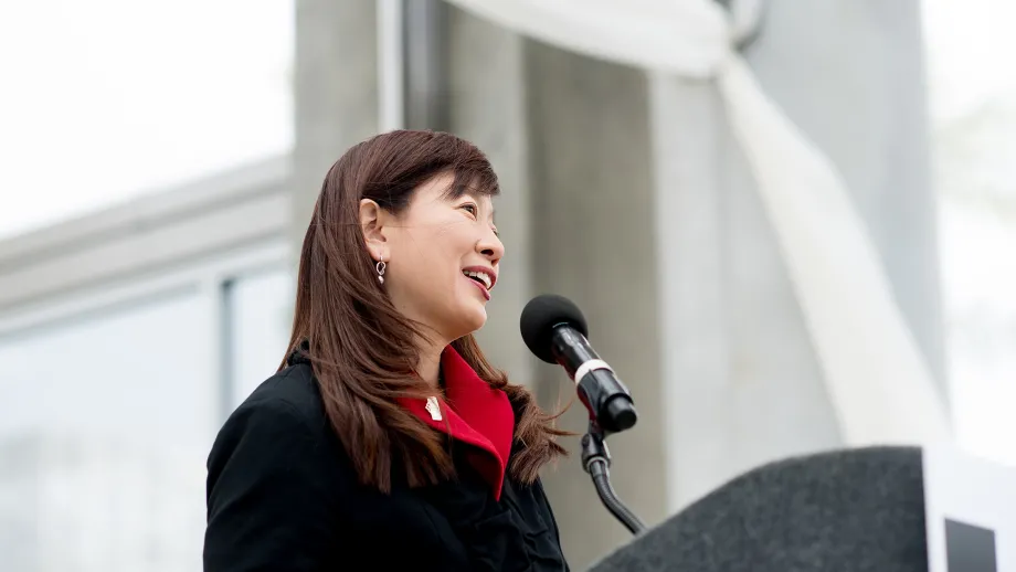 woman talking into a microphone