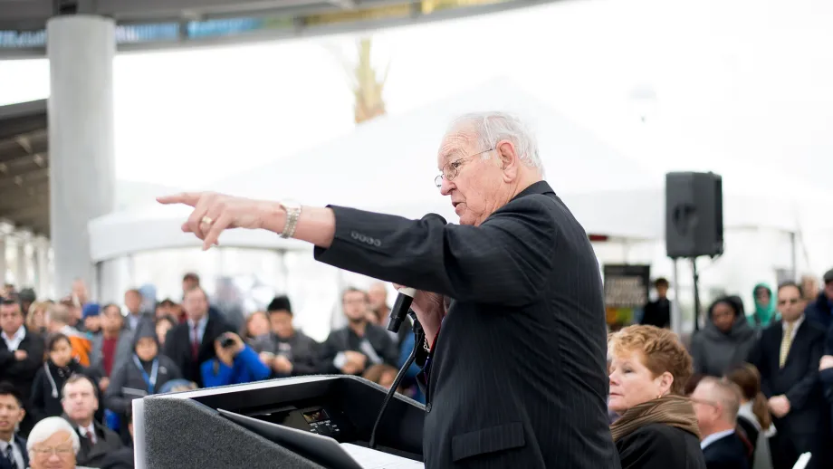 Man at podium talking to a crowd