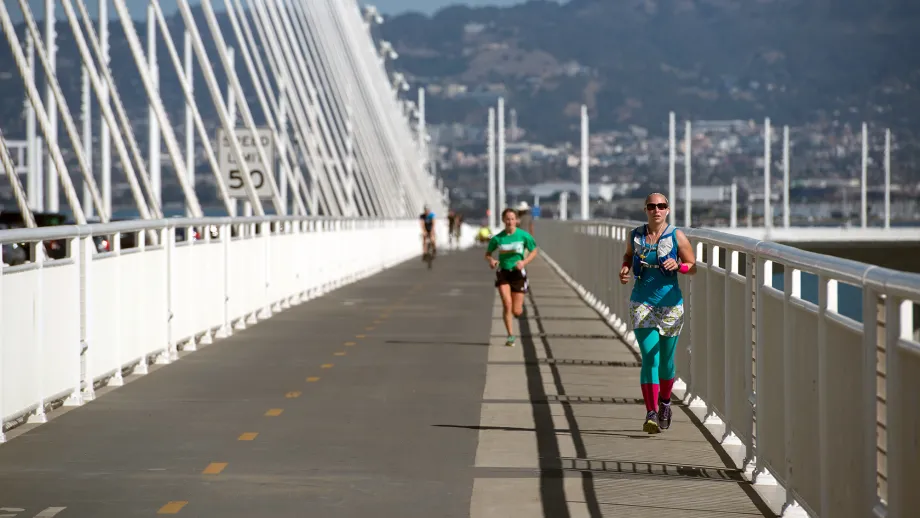 Woman running across new path