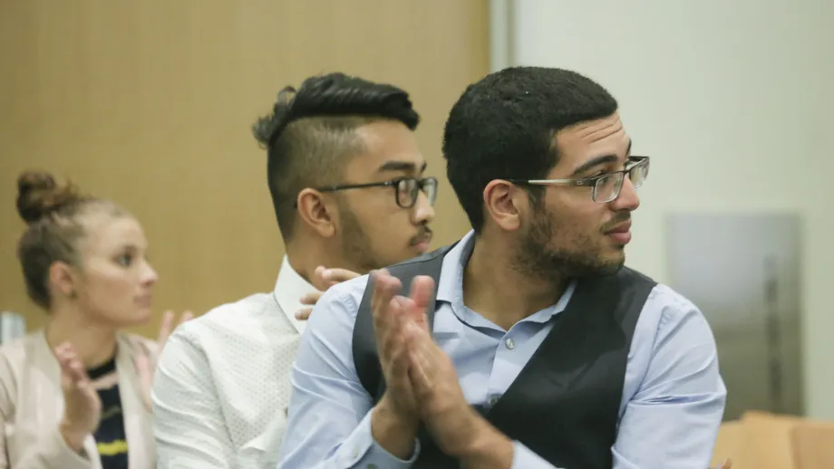 young man clapping