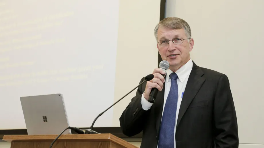 man speaking into a microphone