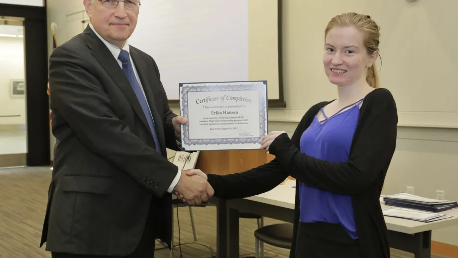 young adult being presented with an award