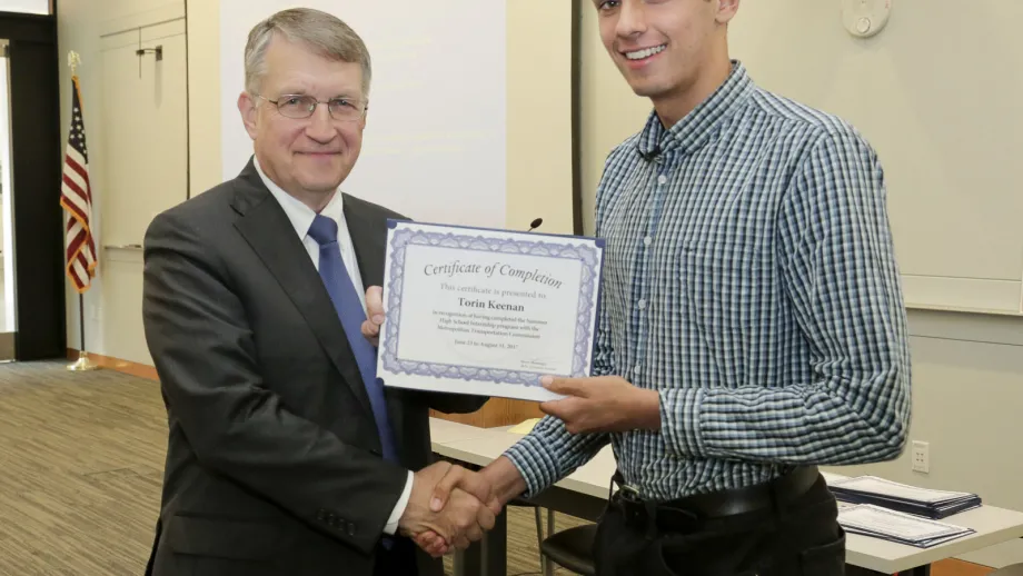 young adult being presented with an award