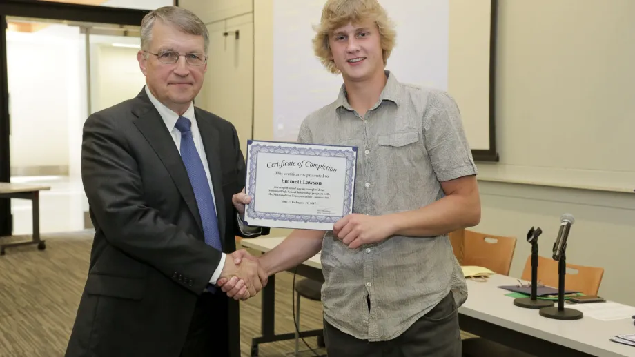 young adult being presented with an award