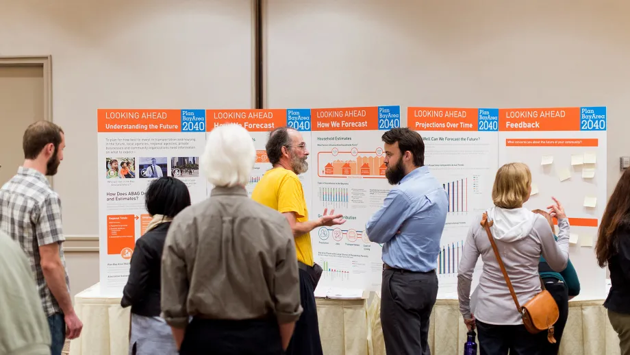 Members of the public examine a display