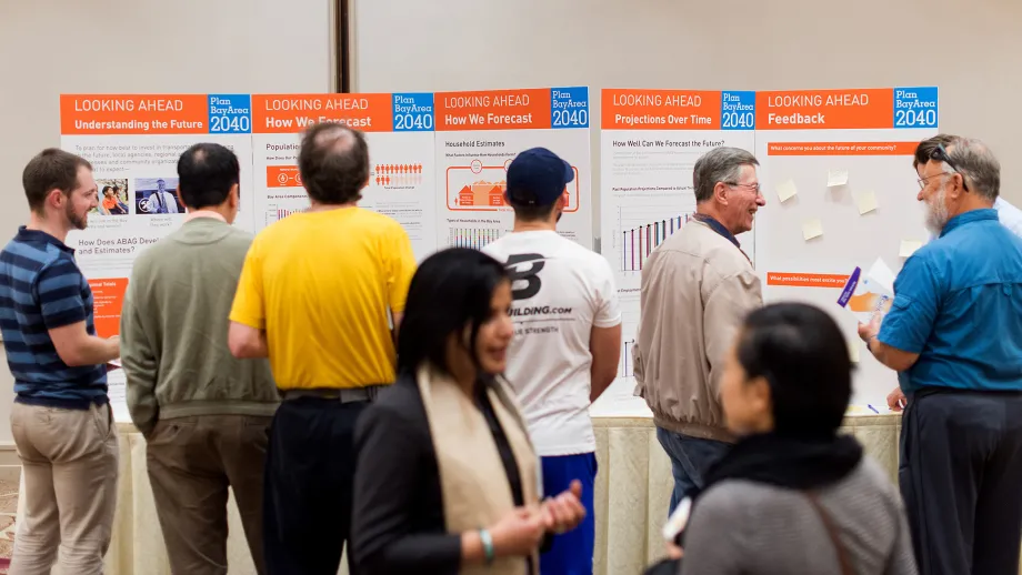 Members of the public examine the information displays