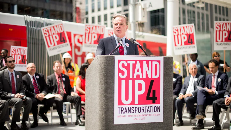 MTC Chair Dave Cortese (at the podium) serving as the SU4T event MC