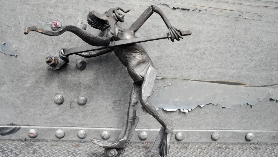 Measuring 2 feet tall and wielding a spud wrench, the senior troll sports spiraling goat horns, a gaping muzzle, a dragon tongue-beard and webbed feet that are suggestive of a great mythological creature. 