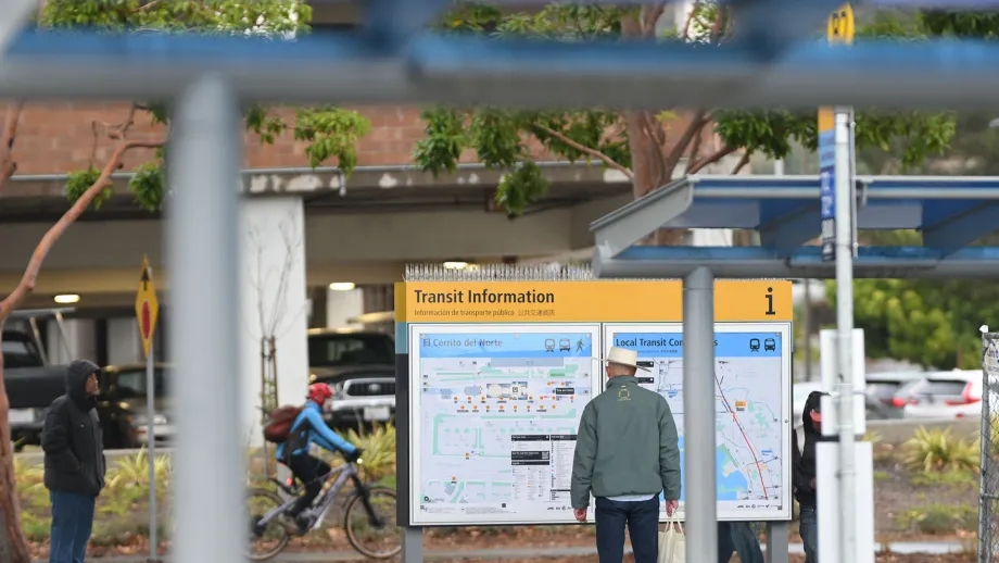 A person reading the new maps at El Cerrito del Norte station.