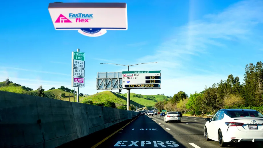 A Fastrak Flex toll tag on the winshield of a car using an Express Lane.