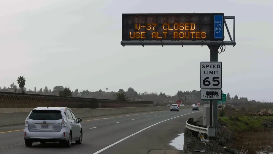 A highway message sign indicating closures of Highway 37.