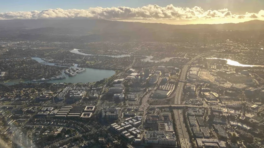 Aerial view of Foster City with the sunset behind the mountains. 