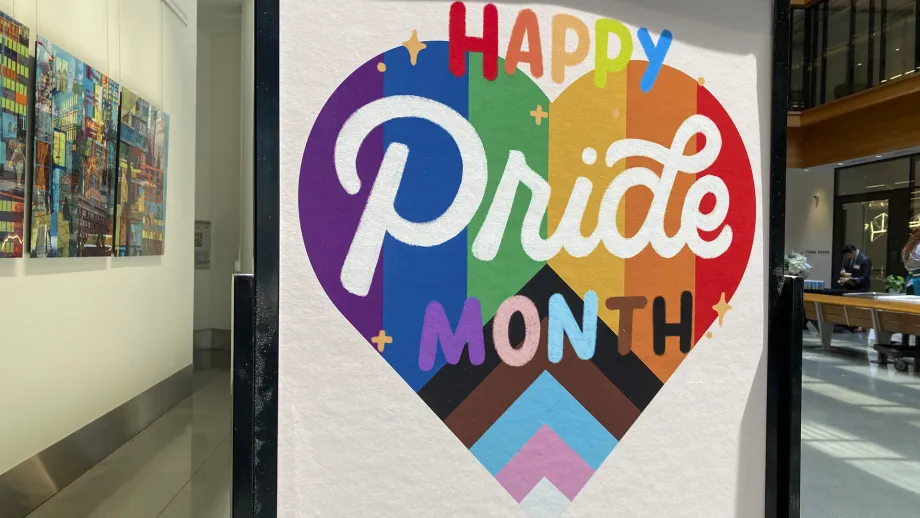 Sign reading Happy Pride Month at the Bay Area Metro Center.