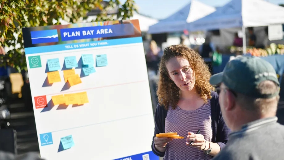 MTC/ABAG staff talking with members of the public at a Plan Bay Area pop-up event.